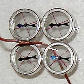 The effect of current through a wire on the alignment of magnetic plotting compasses